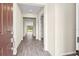Inviting foyer with beautiful wood-look flooring that leads into the bright, open-concept living spaces of the home at 9292 Tequila Sunrise Dr, Sarasota, FL 34241