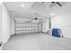 Large garage with modern door, epoxy flooring, high ceilings and plenty of space at 9292 Tequila Sunrise Dr, Sarasota, FL 34241