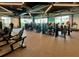 Bright gym with state-of-the-art equipment and large windows overlooking community at 9292 Tequila Sunrise Dr, Sarasota, FL 34241