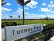Sign for Turner Park at Skye Ranch, with an out-of-focus baseball field in the background at 9292 Tequila Sunrise Dr, Sarasota, FL 34241