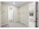 Walk-in closet featuring wire shelving for storage, with an adjoining bathroom at 9292 Tequila Sunrise Dr, Sarasota, FL 34241