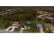 An aerial view of a suburban neighborhood featuring lush greenery, swimming pools, and well-maintained homes with modern amenities at 10022 Laurel Valley Avenue Cir, Bradenton, FL 34202