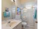 Bright bathroom featuring a glass-enclosed shower and beach-themed decor at 10022 Laurel Valley Avenue Cir, Bradenton, FL 34202