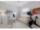Versatile room with a desk, sofa, and exercise equipment at 10022 Laurel Valley Avenue Cir, Bradenton, FL 34202