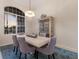 Formal dining area with stylish chandelier, comfortable seating, and a large window offering beautiful views of the outdoors at 10022 Laurel Valley Avenue Cir, Bradenton, FL 34202