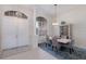 Elegant dining room features a chandelier, large window, and seating for six around a stylish table at 10022 Laurel Valley Avenue Cir, Bradenton, FL 34202
