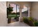 View from the covered front porch showcasing decorative columns and inviting walkway, perfect for enjoying the outdoors at 10022 Laurel Valley Avenue Cir, Bradenton, FL 34202