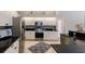 Modern kitchen with stainless steel appliances, granite countertops, and ample cabinet space at 10022 Laurel Valley Avenue Cir, Bradenton, FL 34202