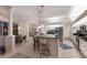 Open kitchen with bar seating, stainless steel appliances, and easy access to the living and dining areas at 10022 Laurel Valley Avenue Cir, Bradenton, FL 34202