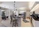 Eat-in kitchen featuring white cabinets, granite counters, stainless appliances, and bar stool seating at 10022 Laurel Valley Avenue Cir, Bradenton, FL 34202