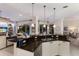 Bright kitchen with dark countertops, white cabinets, and stainless steel appliances, perfect for modern living at 10022 Laurel Valley Avenue Cir, Bradenton, FL 34202