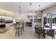 Modern kitchen with granite countertops, stainless steel appliances, and a breakfast bar at 10022 Laurel Valley Avenue Cir, Bradenton, FL 34202