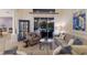 Bright living area featuring neutral tones, chic furnishings, and a seamless transition to the outdoor pool and patio space at 10022 Laurel Valley Avenue Cir, Bradenton, FL 34202