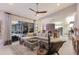 Spacious living room leading to the kitchen, with sliding glass doors to the outdoor lounge area at 10022 Laurel Valley Avenue Cir, Bradenton, FL 34202