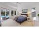 Spacious main bedroom featuring tray ceilings and bright natural light at 10022 Laurel Valley Avenue Cir, Bradenton, FL 34202
