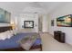 Comfortable main bedroom with tray ceiling, beach decor and a walk-in closet at 10022 Laurel Valley Avenue Cir, Bradenton, FL 34202