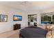 Light-filled main bedroom with vaulted ceiling, private outdoor lounge, and a picturesque pool view at 10022 Laurel Valley Avenue Cir, Bradenton, FL 34202