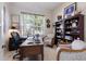 Bright office space with built-in shelves and plenty of natural light from the window at 10022 Laurel Valley Avenue Cir, Bradenton, FL 34202
