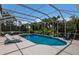 Screened-in pool area surrounded by lush landscaping at 10022 Laurel Valley Avenue Cir, Bradenton, FL 34202