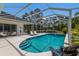 Inviting screened-in pool with spa and seating at 10022 Laurel Valley Avenue Cir, Bradenton, FL 34202