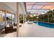 Covered pool area with a variety of seating options, perfect for enjoying the Florida sunshine at 10022 Laurel Valley Avenue Cir, Bradenton, FL 34202