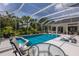 Relaxing screened-in pool and patio area with lush landscaping at 10022 Laurel Valley Avenue Cir, Bradenton, FL 34202
