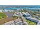 Stunning aerial view of a waterfront community with beautiful landscaping, pool, and tennis courts at 10037 62Nd N Ter # 23, St Petersburg, FL 33708