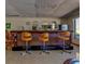 Bar area with three stools and nice lighting with a beautiful mirror background at 10037 62Nd N Ter # 23, St Petersburg, FL 33708