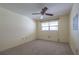 Bedroom with a ceiling fan and a large window for natural light at 10037 62Nd N Ter # 23, St Petersburg, FL 33708