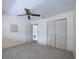 Bedroom with ceiling fan, closet, and neutral carpeting at 10037 62Nd N Ter # 23, St Petersburg, FL 33708