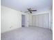 Spacious bedroom with plenty of storage, a ceiling fan and neutral carpet at 10037 62Nd N Ter # 23, St Petersburg, FL 33708