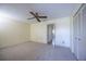 Bedroom with ceiling fan, closet, and neutral carpeting at 10037 62Nd N Ter # 23, St Petersburg, FL 33708