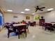 A cozy card room features multiple tables and chairs for friendly games and social gatherings at 10037 62Nd N Ter # 23, St Petersburg, FL 33708