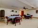 The common room includes tables with comfortable seating, a ceiling fan, and nice decor at 10037 62Nd N Ter # 23, St Petersburg, FL 33708