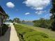 Scenic view of the community's lake, pool and grounds on a beautiful sunny day at 10037 62Nd N Ter # 23, St Petersburg, FL 33708