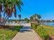 Beautifully landscaped walkway leading to lake views and lush community landscaping at 10037 62Nd N Ter # 23, St Petersburg, FL 33708