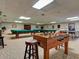 Inside the spacious game room with billiards, ping pong and foosball at 10037 62Nd N Ter # 23, St Petersburg, FL 33708
