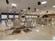 Spacious hall decorated with records, with several tables and chairs, and a stage at 10037 62Nd N Ter # 23, St Petersburg, FL 33708