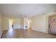 Inviting living room with appealing plank floors, ceiling fan, neutral paint, and a front door at 10037 62Nd N Ter # 23, St Petersburg, FL 33708