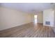 Spacious living room with attractive plank flooring, ceiling fan, and a neutral color scheme at 10037 62Nd N Ter # 23, St Petersburg, FL 33708