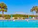 Resort-style pool with plenty of seating and beautiful lush tropical landscaping at 10037 62Nd N Ter # 23, St Petersburg, FL 33708