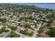 Panoramic aerial view showcasing a neighborhood with lush greenery and waterfront access at 1004 68Th Nw St, Bradenton, FL 34209