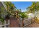 Relaxing backyard space featuring a tropical landscape and a tiki bar at 1004 68Th Nw St, Bradenton, FL 34209