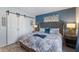 Comfortable bedroom with a sliding door closet, stylish accents and soothing colors at 1004 68Th Nw St, Bradenton, FL 34209