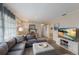Comfortable living room with modern furnishings, plank flooring, and a large sectional couch at 1004 68Th Nw St, Bradenton, FL 34209