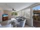 Sun room with comfortable seating, ceiling fan, natural light, and access to outdoor amenities at 1004 68Th Nw St, Bradenton, FL 34209