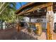 Charming tiki bar with seating and decor adds character to the backyard space at 1004 68Th Nw St, Bradenton, FL 34209
