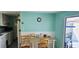Bright dining area with a table set for two, situated near the kitchen for easy serving at 10315 Cortez W Rd # 24-2, Bradenton, FL 34210
