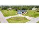 Expansive aerial view of the property showcasing its lush lawn and idyllic neighborhood setting at 1071 Owl Dr, Englewood, FL 34223