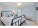 Inviting bedroom with neutral tones, comfortable queen bed, ceiling fan, and calming decor at 1071 Owl Dr, Englewood, FL 34223